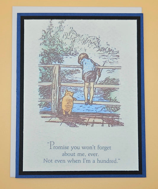 Illustration of a person and a bear on a wooden bridge with text on a card.