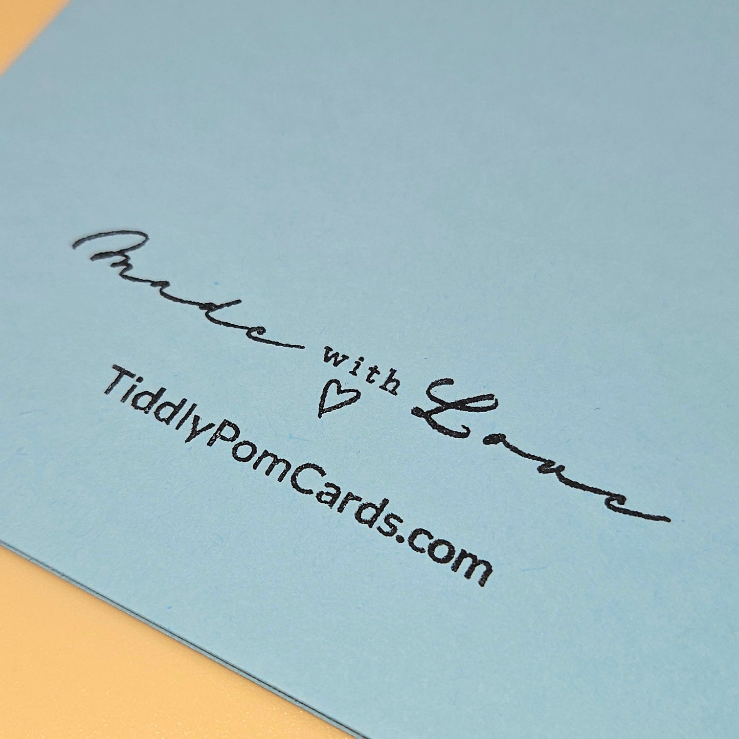 Card with 'Made with Love' text and TiddlyPomCards.com on a light blue background