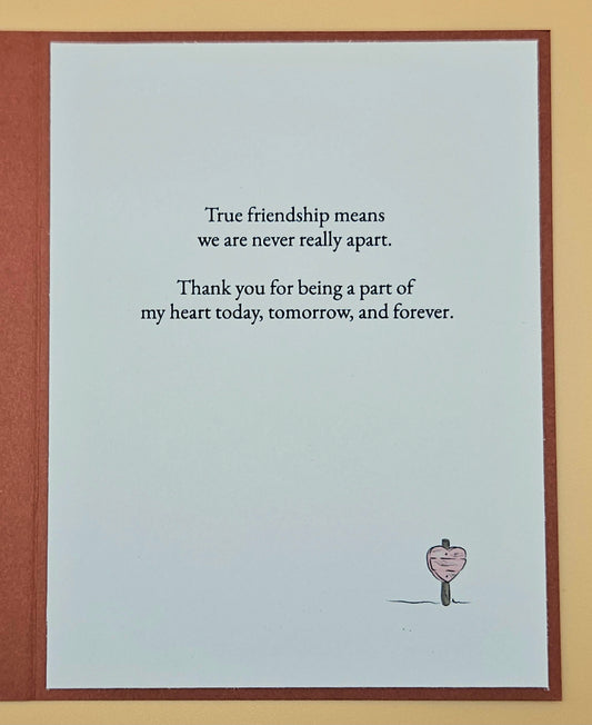 Card with friendship quote and heart illustration on a light blue background