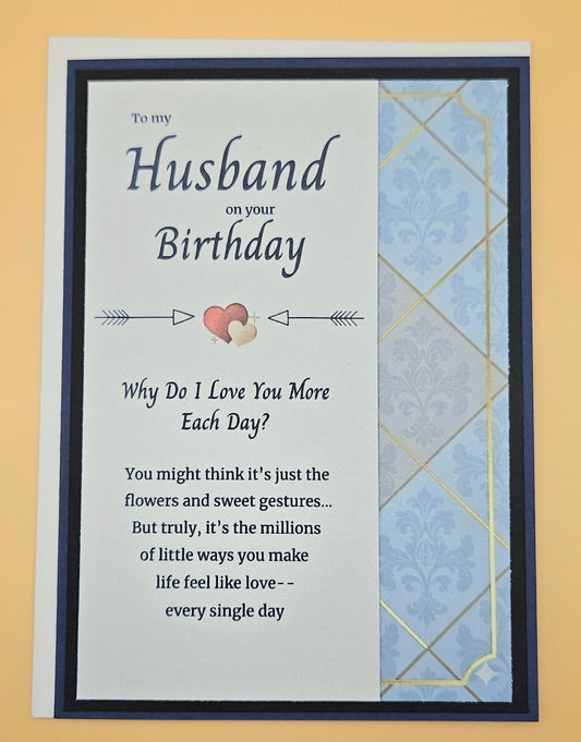 Birthday card for a husband with a heart and arrow design on a blue and gold patterned envelope.
