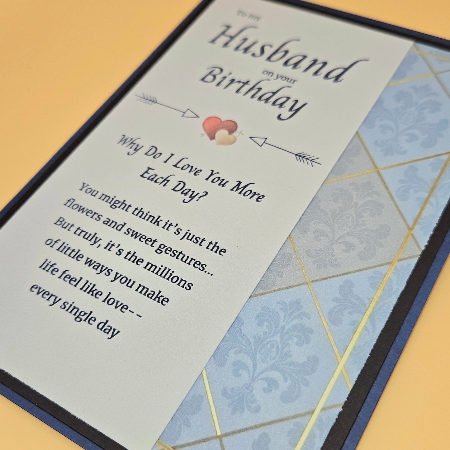 Greeting card for a husband on his birthday with a message and decorative elements.