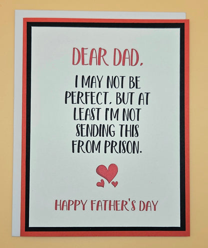 Father's Day card with humorous message and red hearts on a beige background