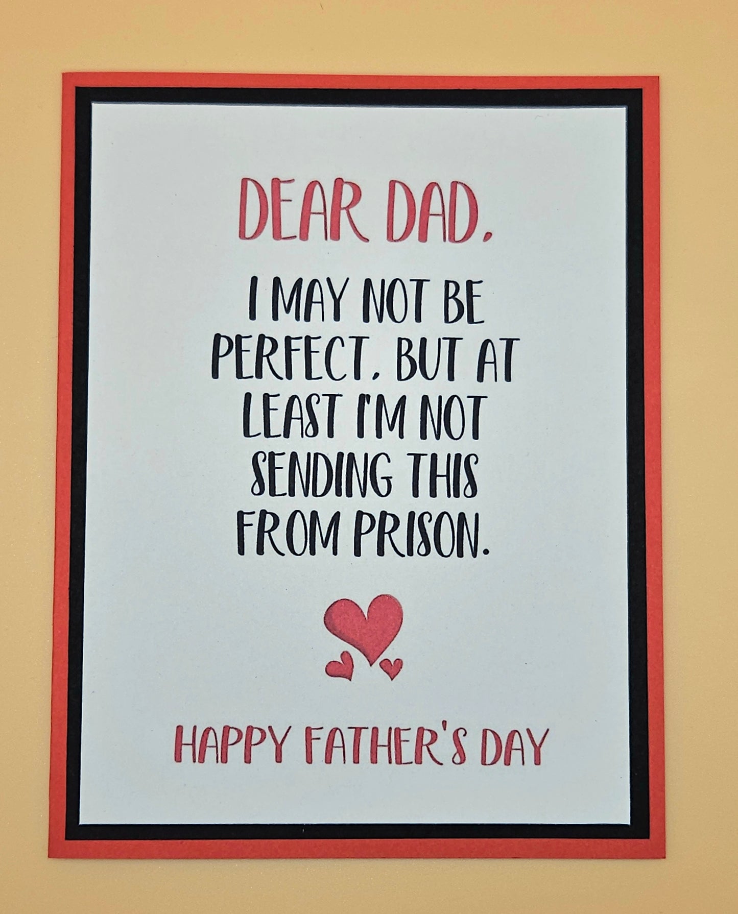 Framed Father's Day card with humorous message and heart on beige background