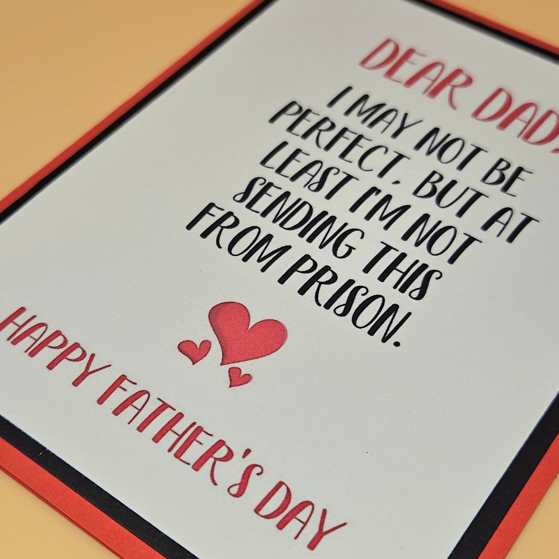 Father's Day card with humorous message and hearts on a plain background
