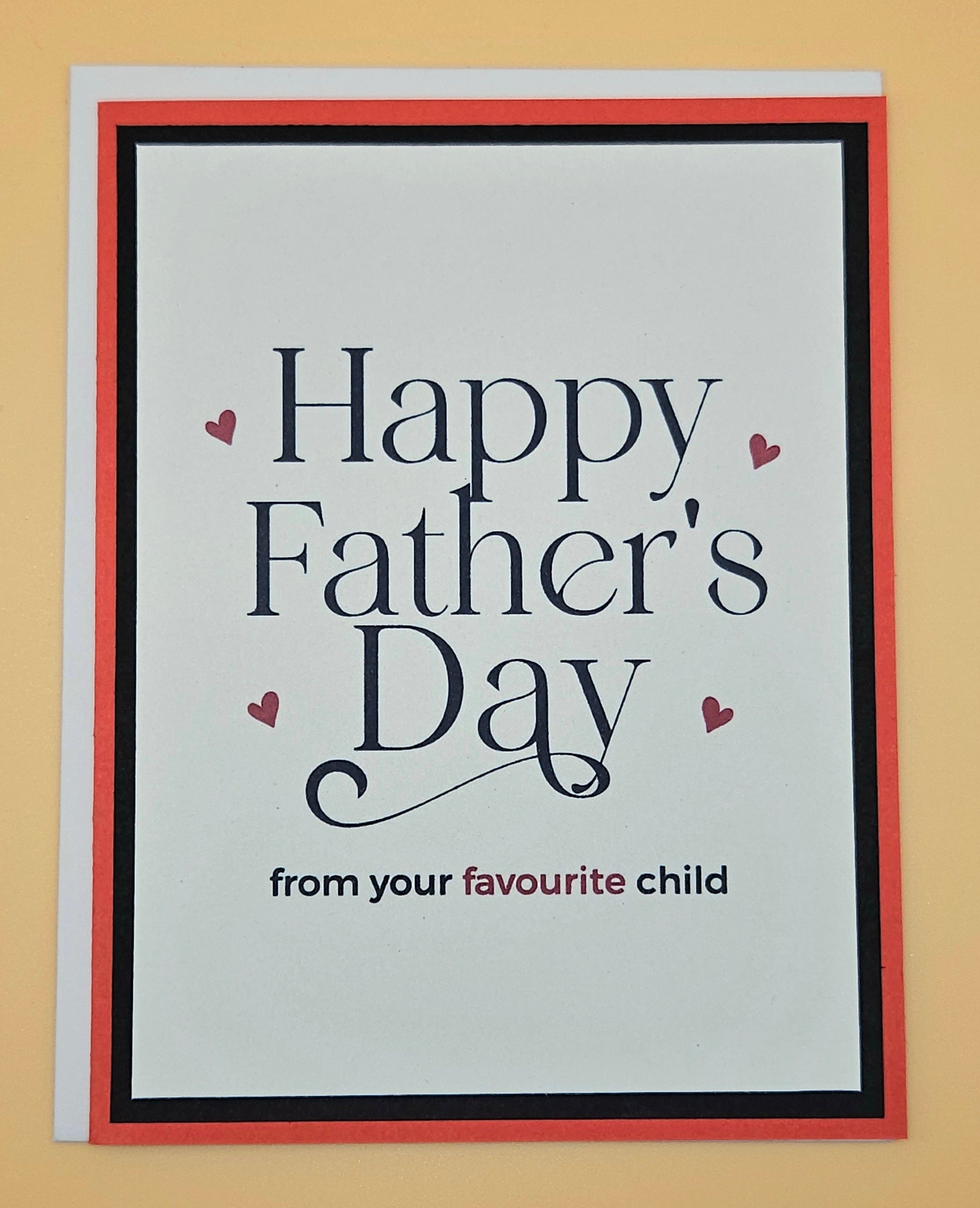 Father's Day card with text 'Happy Father's Day from your favourite child' on a beige background