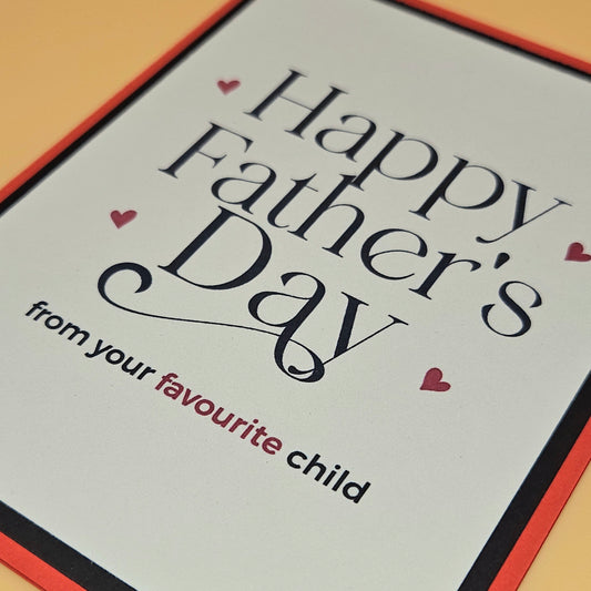 Father's Day card with text 'Happy Father's Day from your favourite child' on a light background.