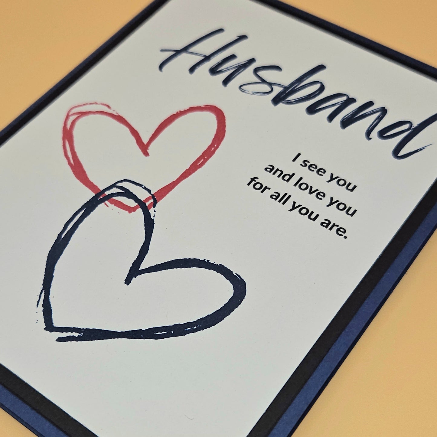 Card for a husband with heart drawings and text on a light background
