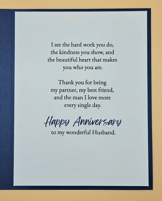 Card with anniversary message for a husband on a blue and beige background