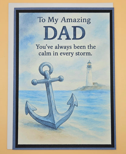 Greeting card with anchor and lighthouse design, text 'To My Amazing DAD You've always been the calm in every storm.'