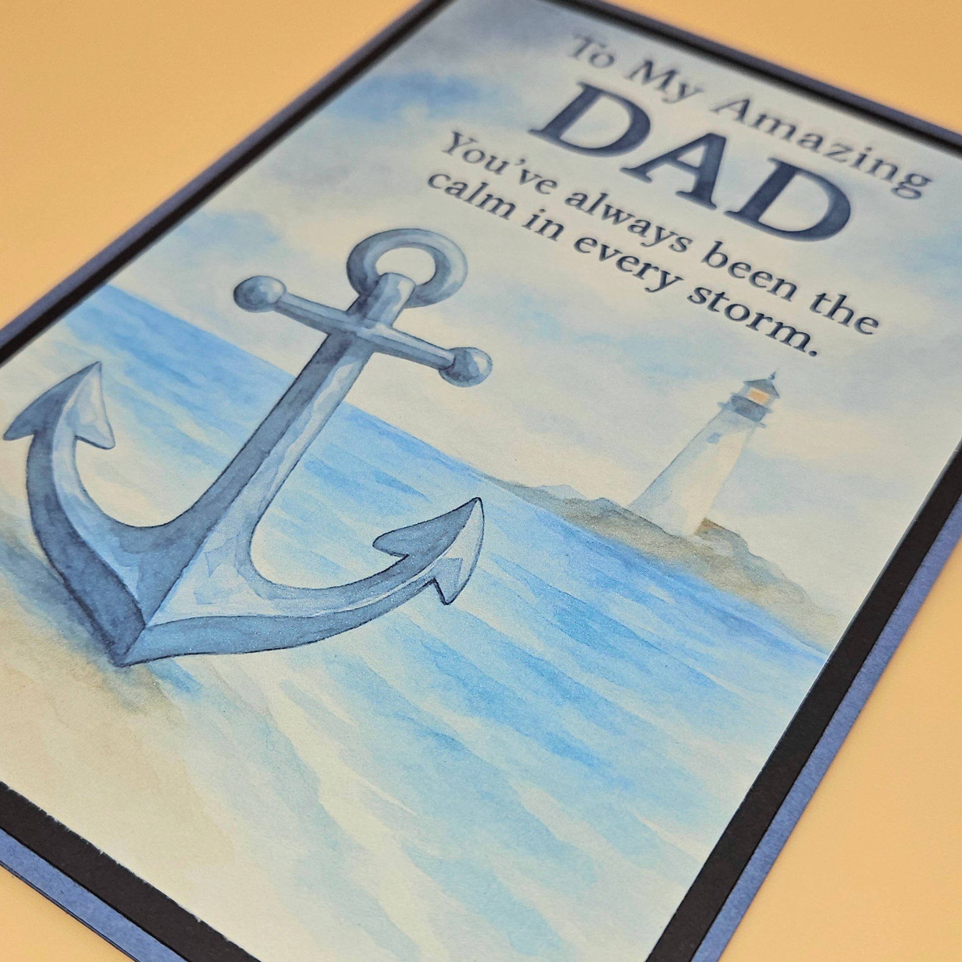 Card with anchor and lighthouse design, featuring text for an amazing dad.