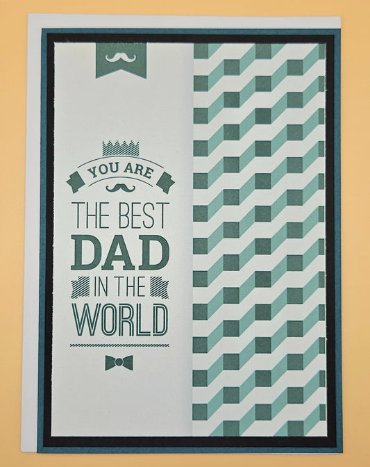 Greeting card with text 'You are the best dad in the world' and geometric pattern on a beige background