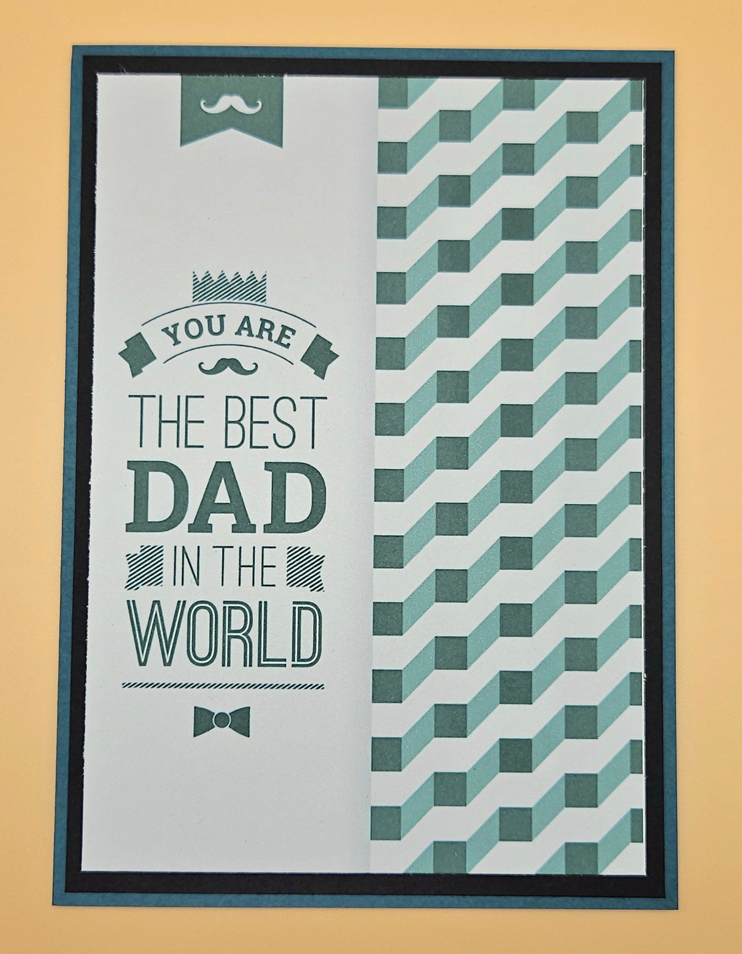 Greeting card with text 'You are the best dad in the world' on a geometric patterned background