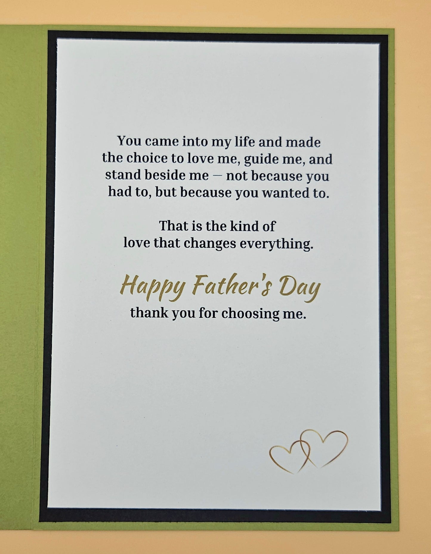 Framed Father's Day card with a heartfelt message and two hearts on a beige background