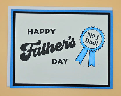 Father's Day card with 'Happy Father's Day' text and a blue ribbon badge on a beige background