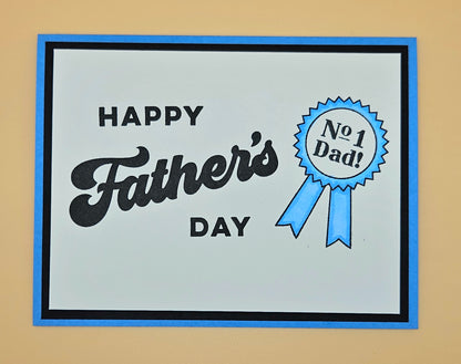 Father's Day card with 'Happy Father's Day' text and a blue ribbon badge on a beige background