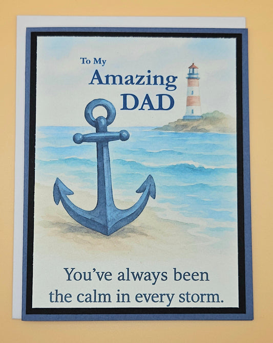 Greeting card with anchor and lighthouse design, text 'To My Amazing DAD You've always been the calm in every storm.'