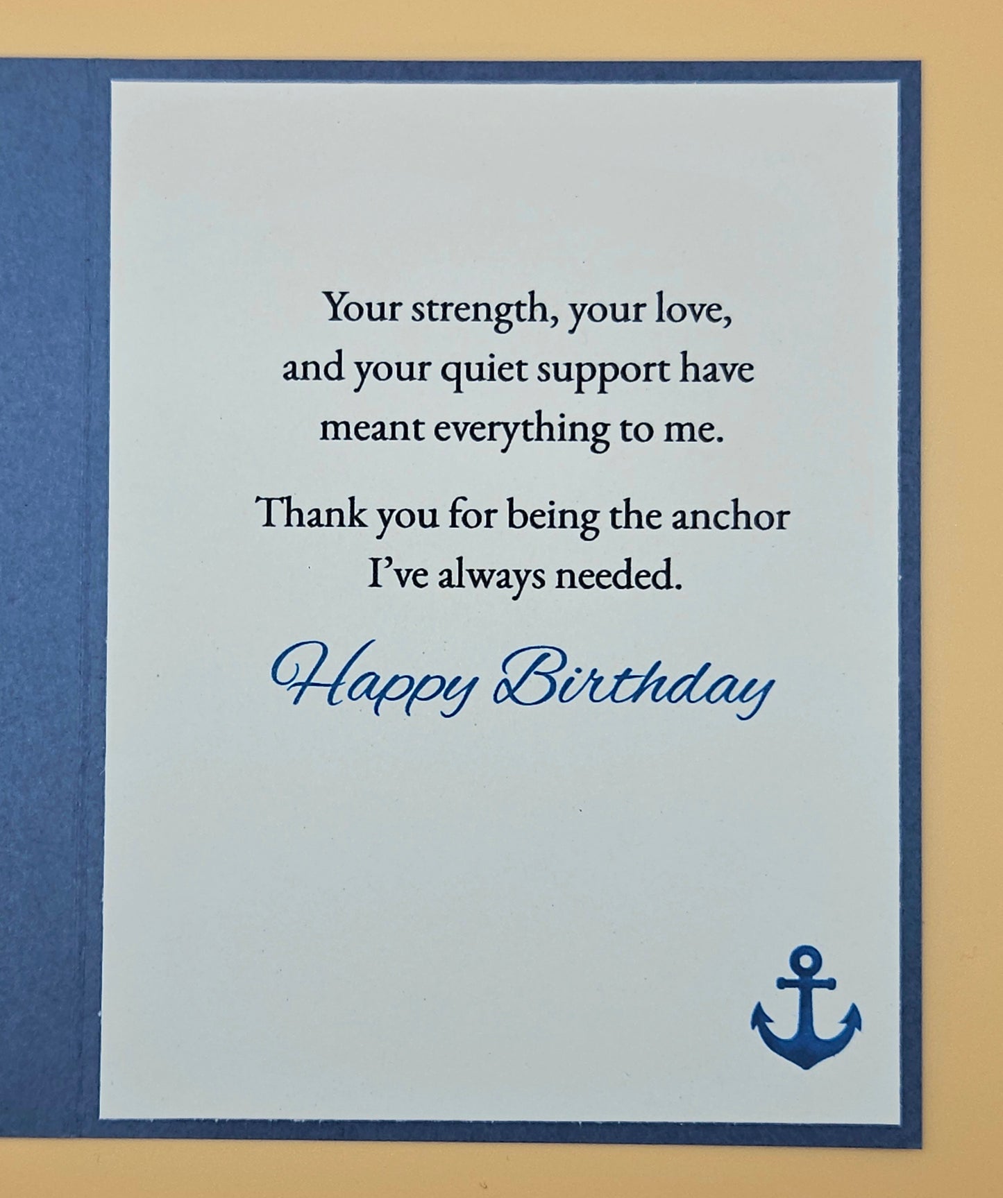 Birthday card with a message of appreciation and an anchor symbol on a blue and beige background.