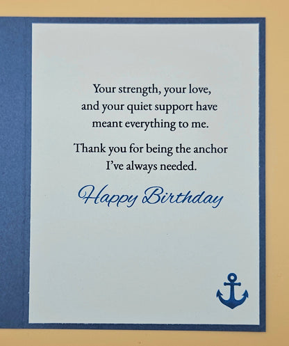Birthday card with a message of appreciation and an anchor symbol on a blue and beige background.