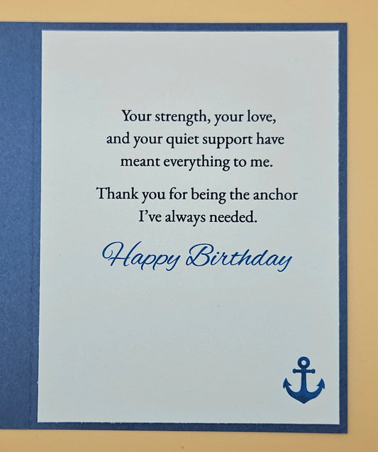 Birthday card with a message of appreciation and an anchor symbol on a blue and beige background.