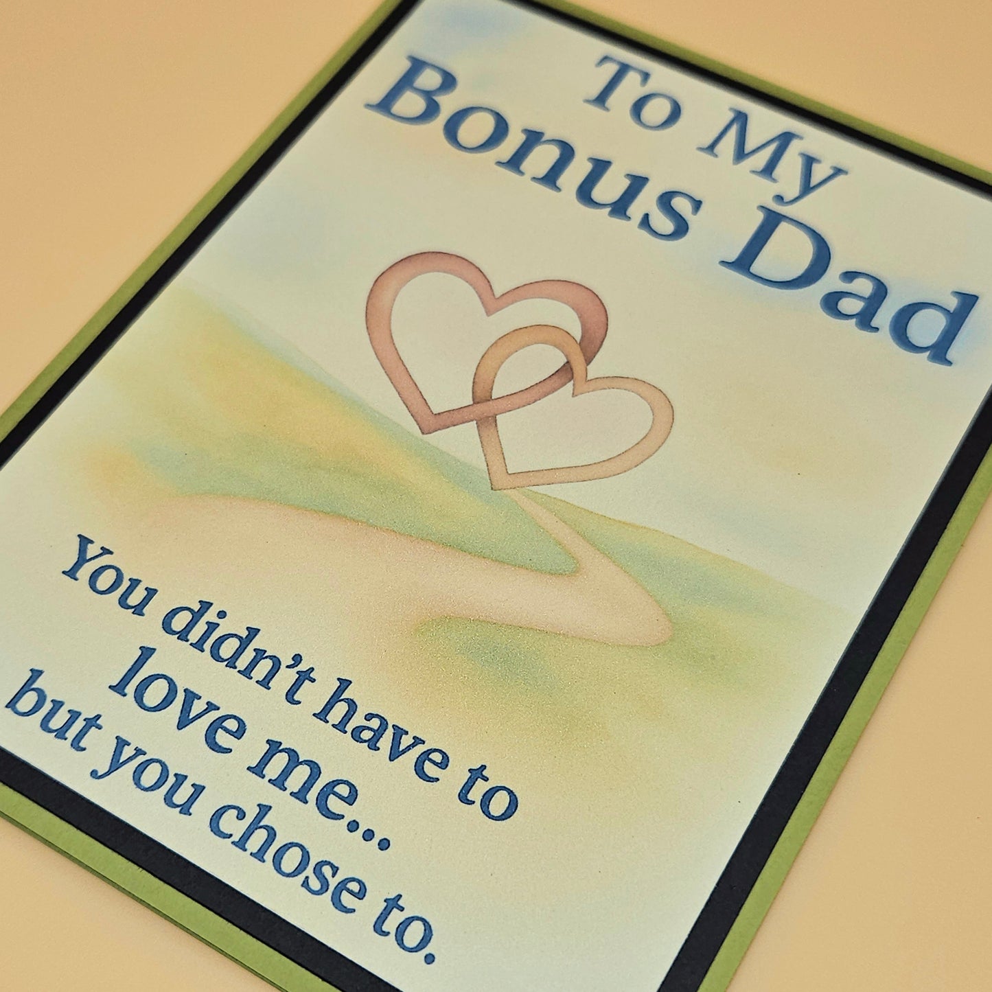 Card for 'Bonus Dad' with two interlocking hearts and a message.
