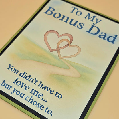 Card for 'Bonus Dad' with two interlocking hearts and a message.