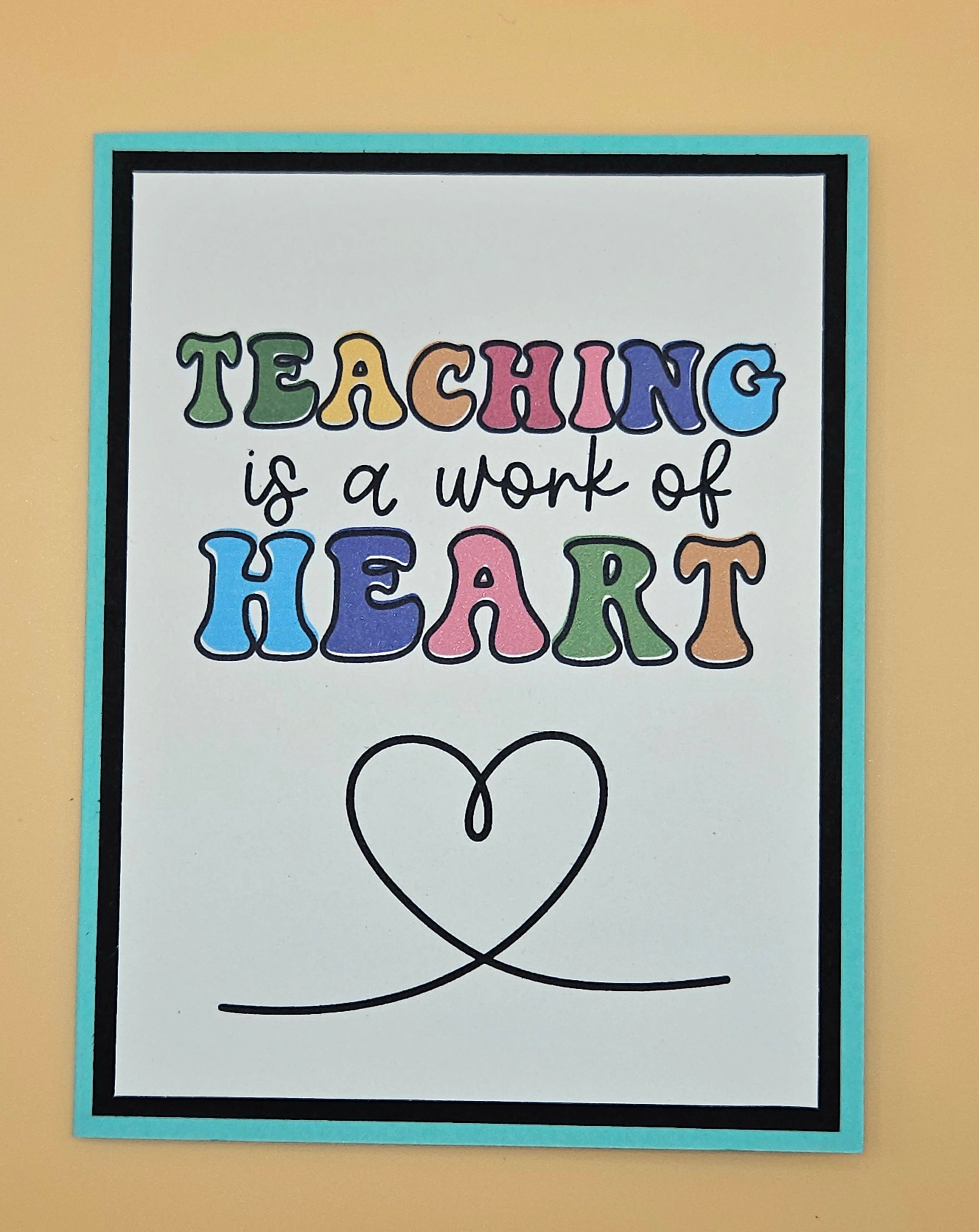 Poster with 'Teaching is a work of heart' text on a beige background