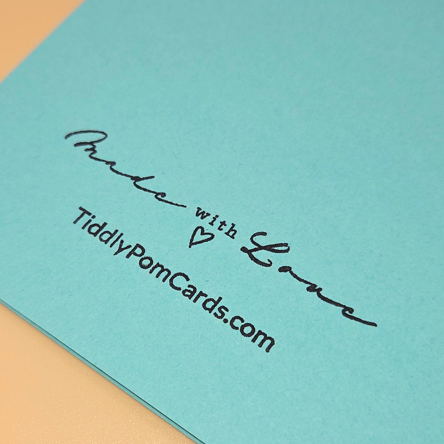 Light blue card with 'Made with Love' text and TiddlyPomCards.com on a beige background