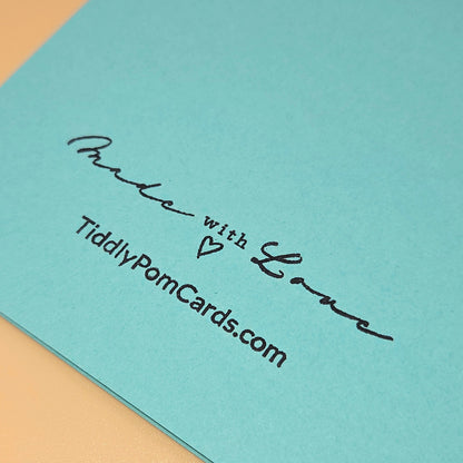 Light blue card with 'Made with Love' text and TiddlyPomCards.com on a beige background