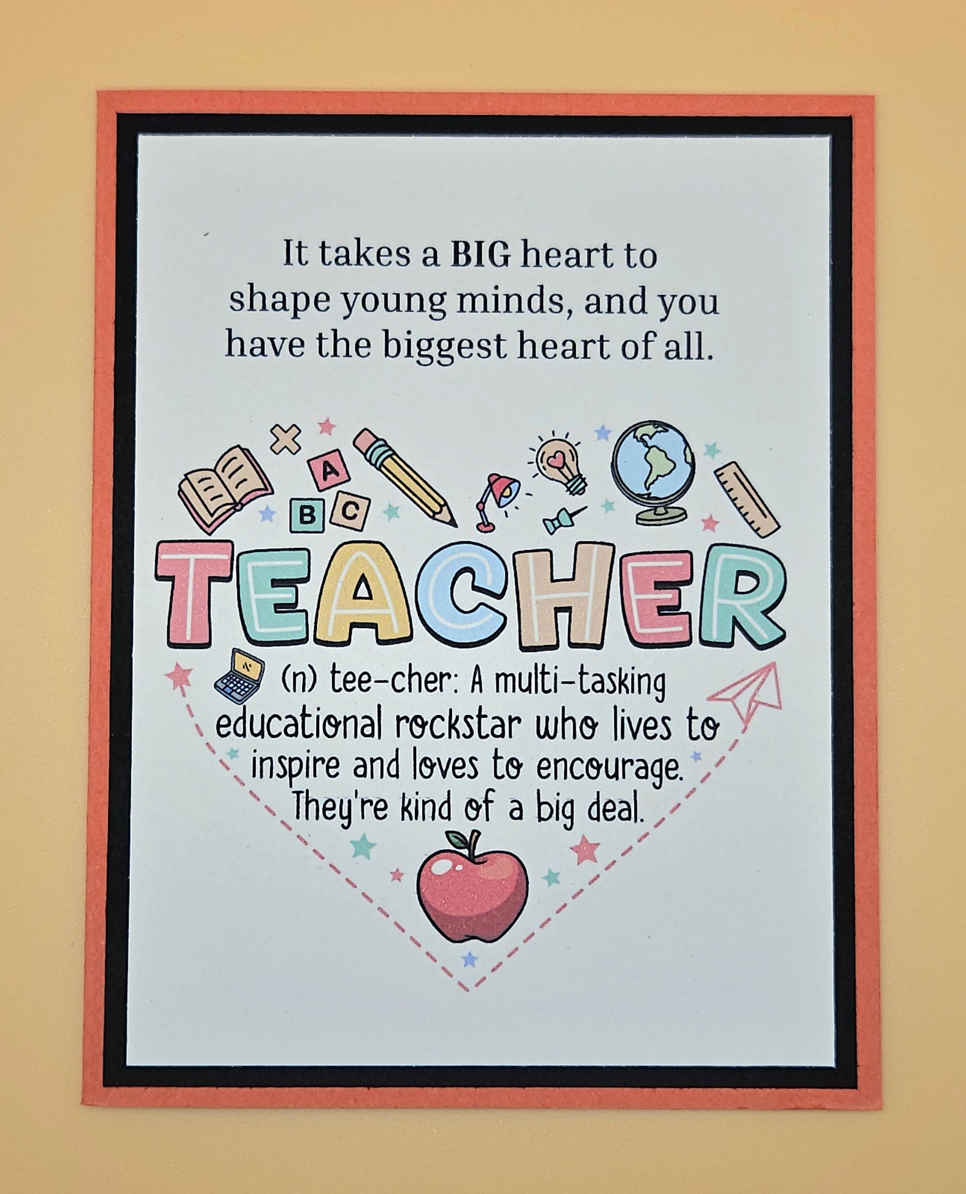 Framed poster with colorful text and graphics about teachers on a beige background