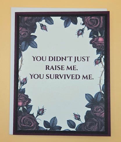 Card with floral design and humorous quote on a beige background