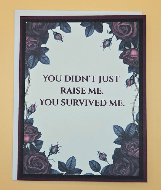 Card with floral design and humorous quote on a beige background