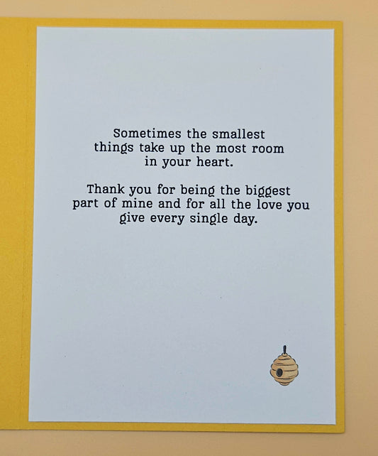 Card with a bee illustration and heartfelt message on a light blue background.