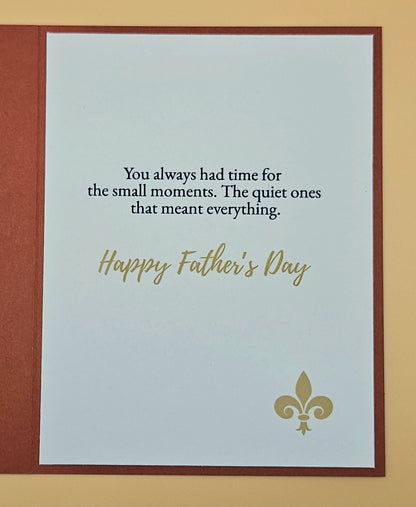 Father's Day card with text and fleur-de-lis design on a beige background