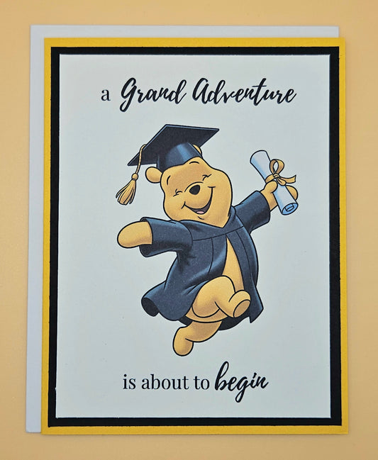 Graduation-themed card with a cartoon bear in a cap and gown on a beige background