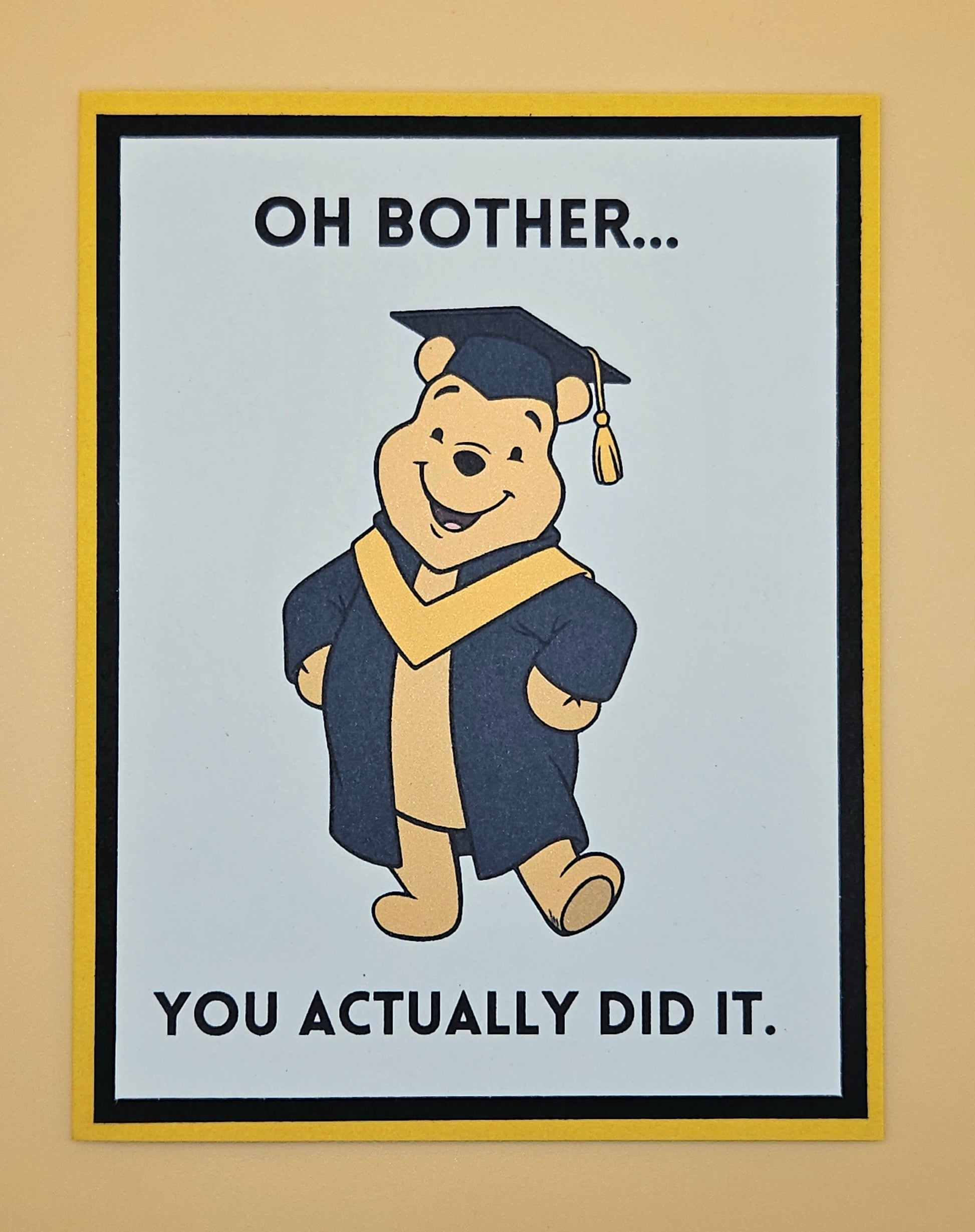 Cartoon bear in graduation attire with text on a beige background