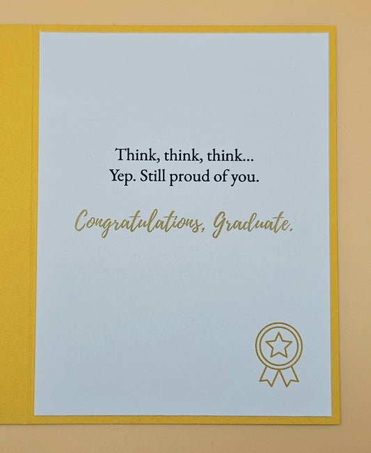 Graduation card with text and a star emblem on a light blue background