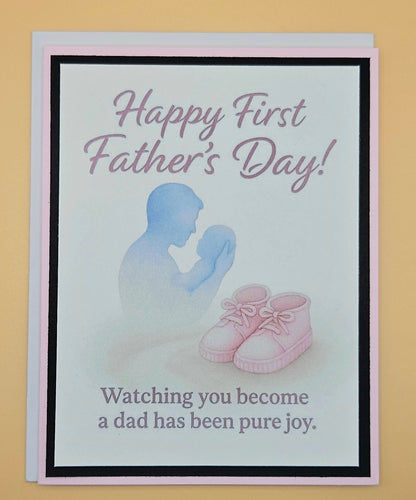 First Father's Day card for new dad with baby girl, watercolor dad cradling newborn silhouette, soft pink peach border A2 keepsake