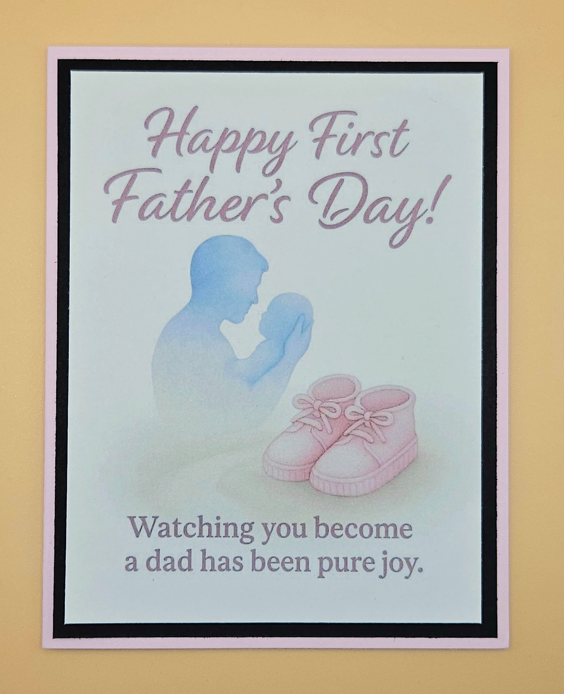 First Father's Day card from wife to husband, girl dad card with pink peach border and baby booties detail