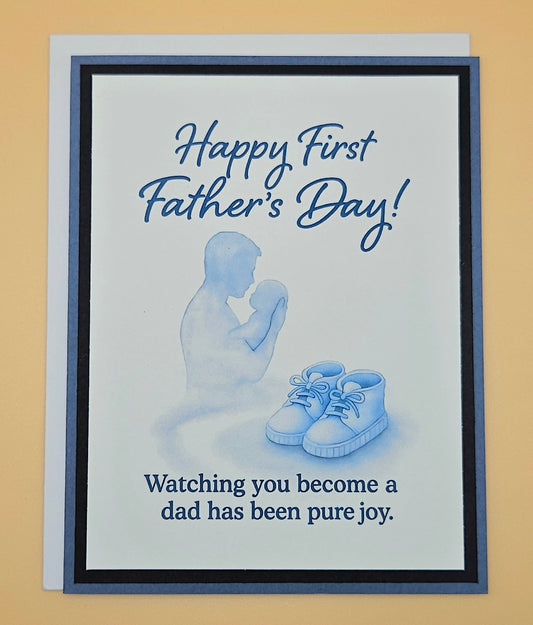 Father's Day card with silhouette of a father and baby shoes, text 'Happy First Father's Day! Watching you become a dad has been pure joy.'.