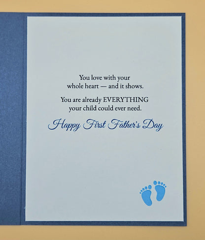 Father's Day card with text and blue footprints on a beige background