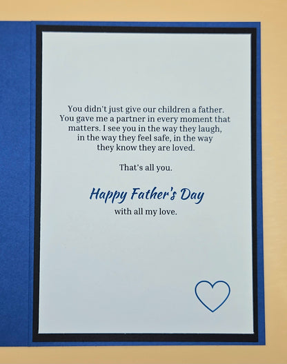 Inside of Father's Day husband card showing printed heartfelt sentiment and blue compass accent