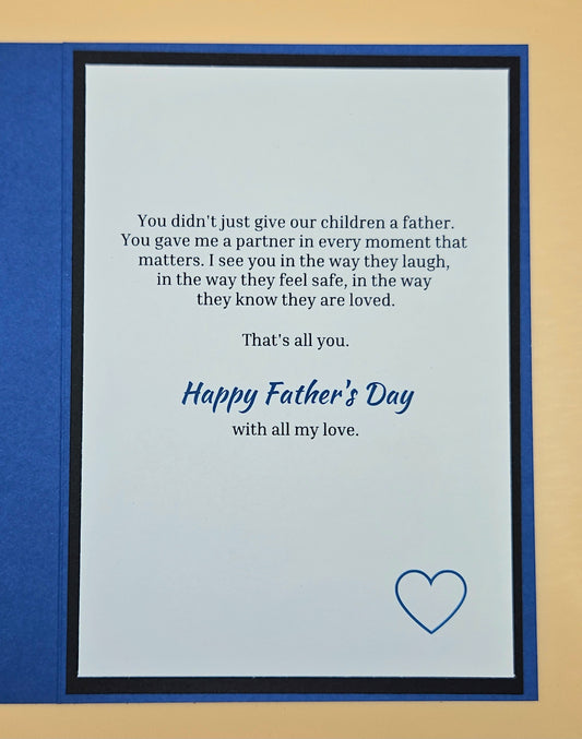 Inside of Father's Day husband card showing printed heartfelt sentiment and blue compass accent