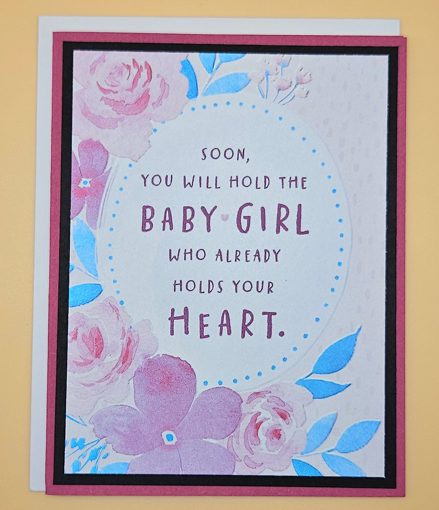 Greeting card with floral design and text on a yellow background