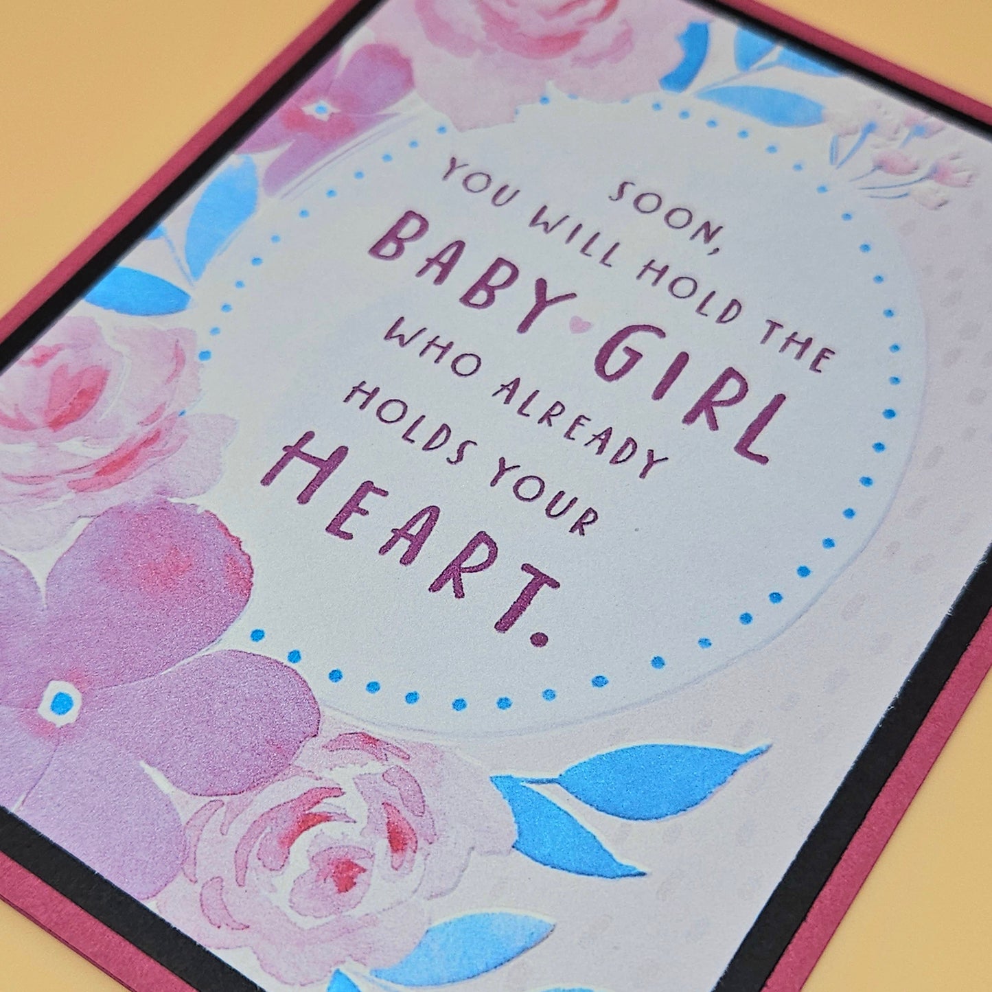 Greeting card with floral design and text on a yellow background