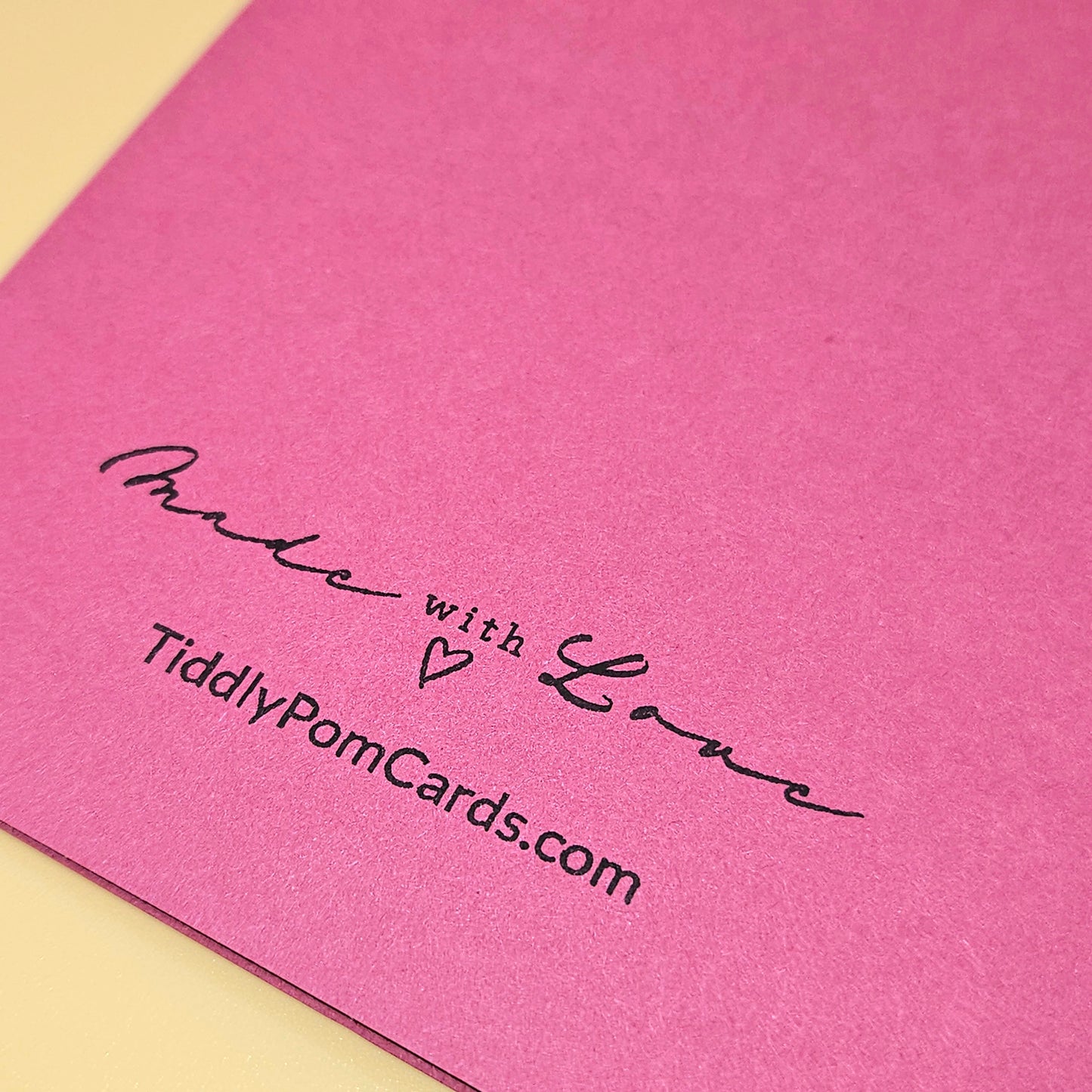 Pink card with 'Made with Love' text and TiddlyPomCards.com on a yellow background