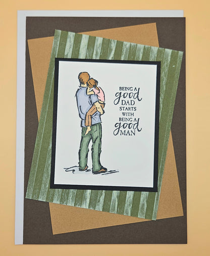 Birthday card for Dad with hand-colored Good Man design, father holding child illustration, 5x7 layered keepsake — white skin tone