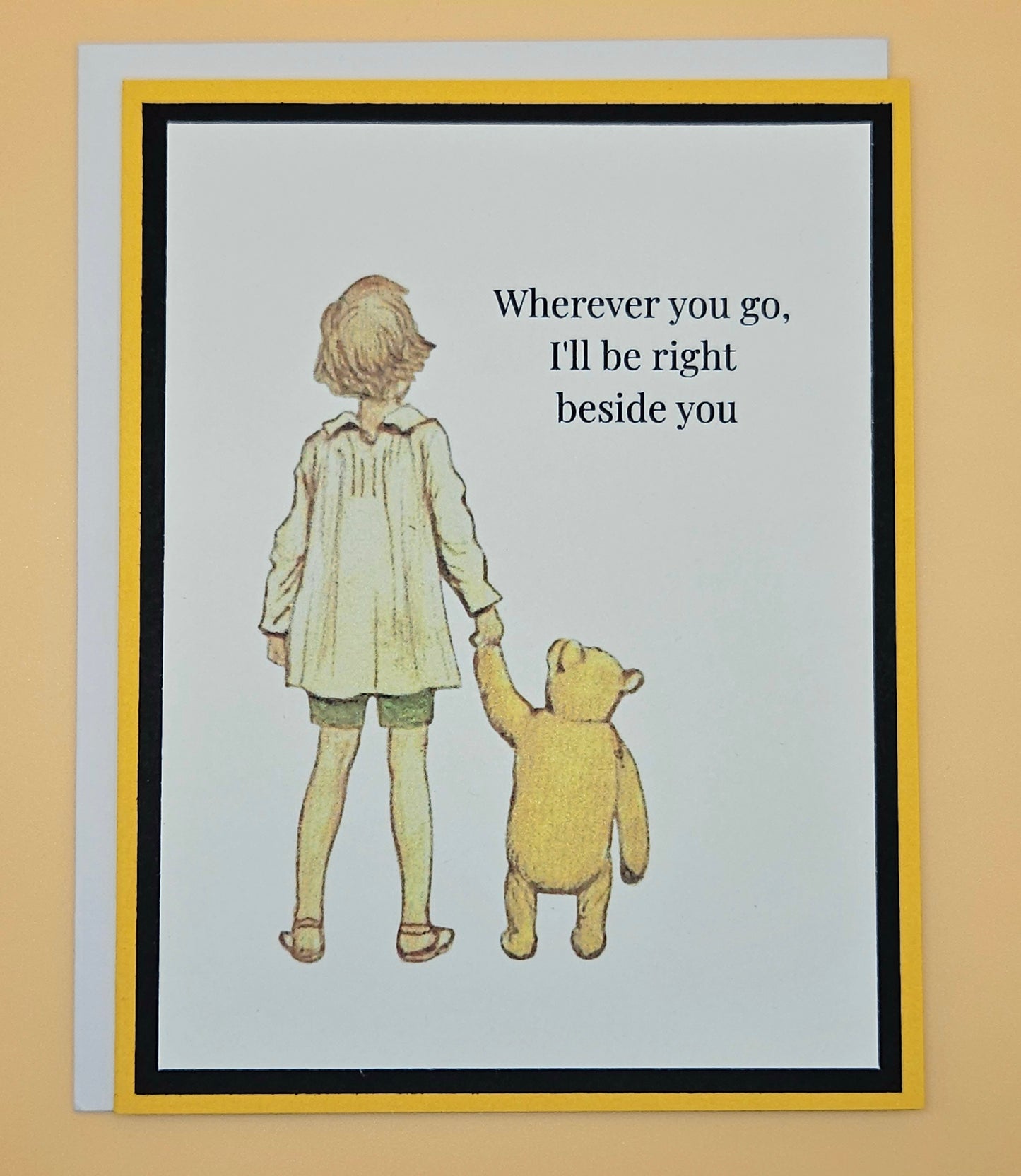 Handmade Winnie the Pooh friendship card featuring classic Christopher Robin and Pooh walking hand in hand illustration with warm yellow and black layered cardstock frames