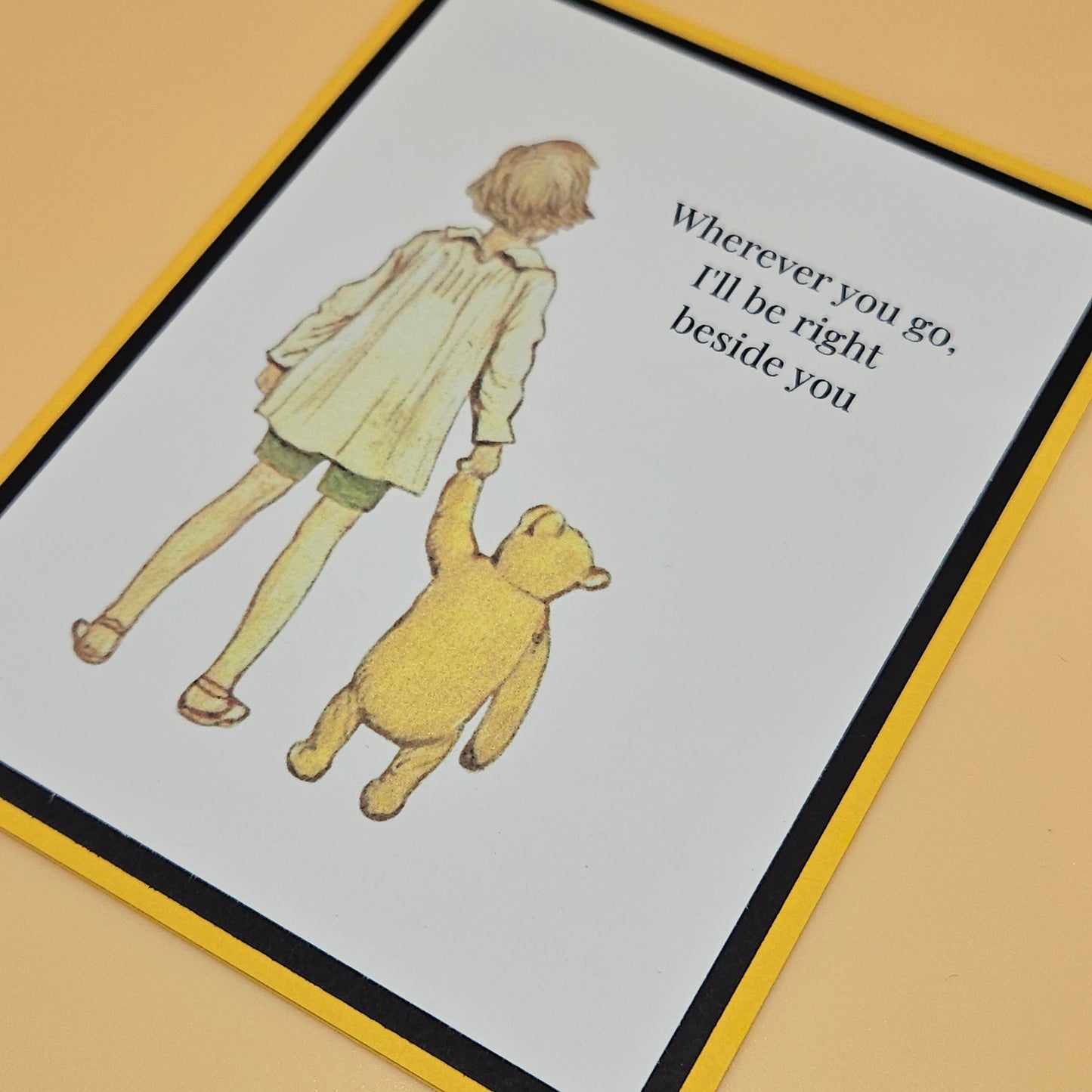 Illustration of a child and a bear with text on a card