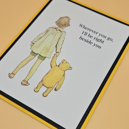 Illustration of a child and a bear with text on a card