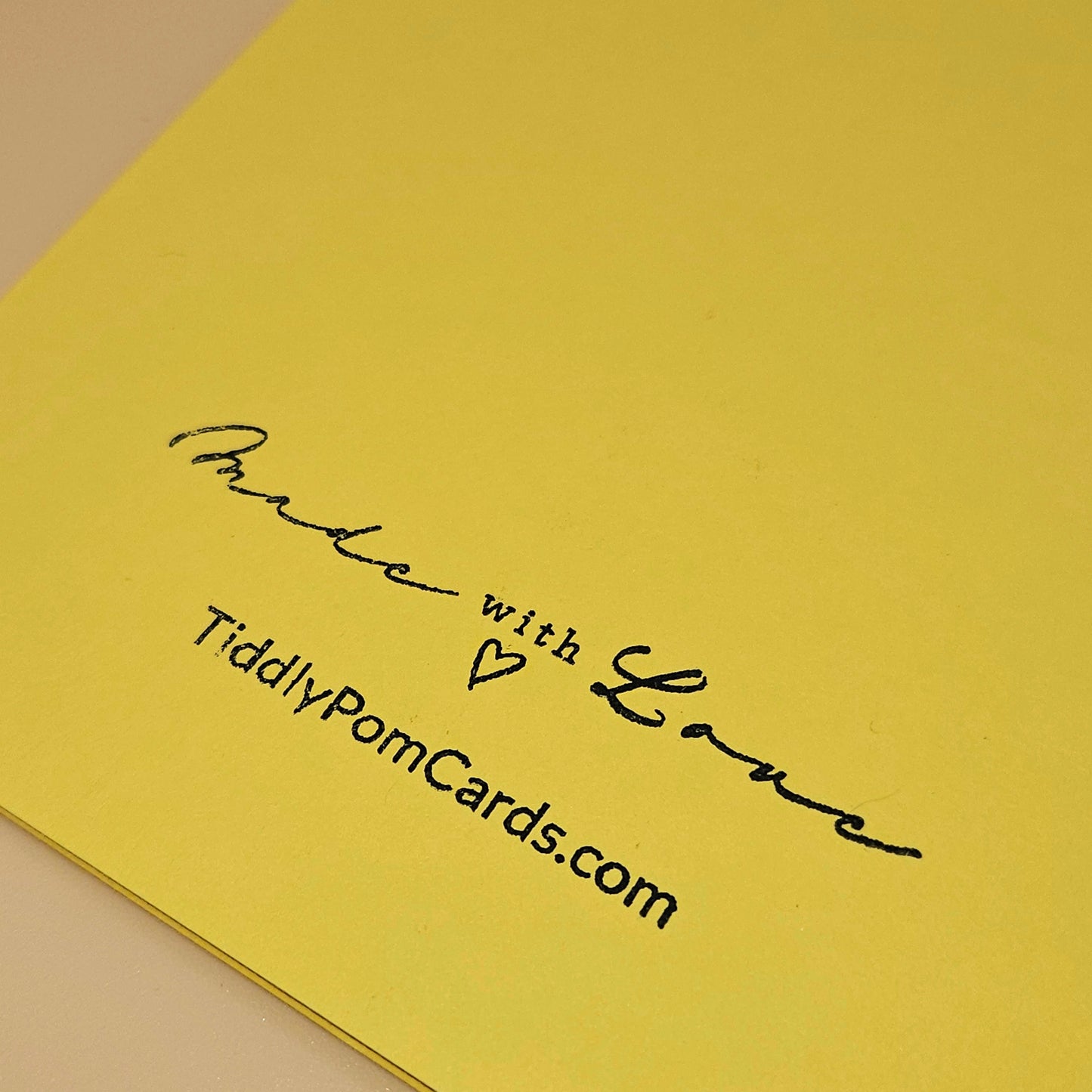 Yellow card with 'Made with Love' text and TiddlyPomCards.com on a beige background